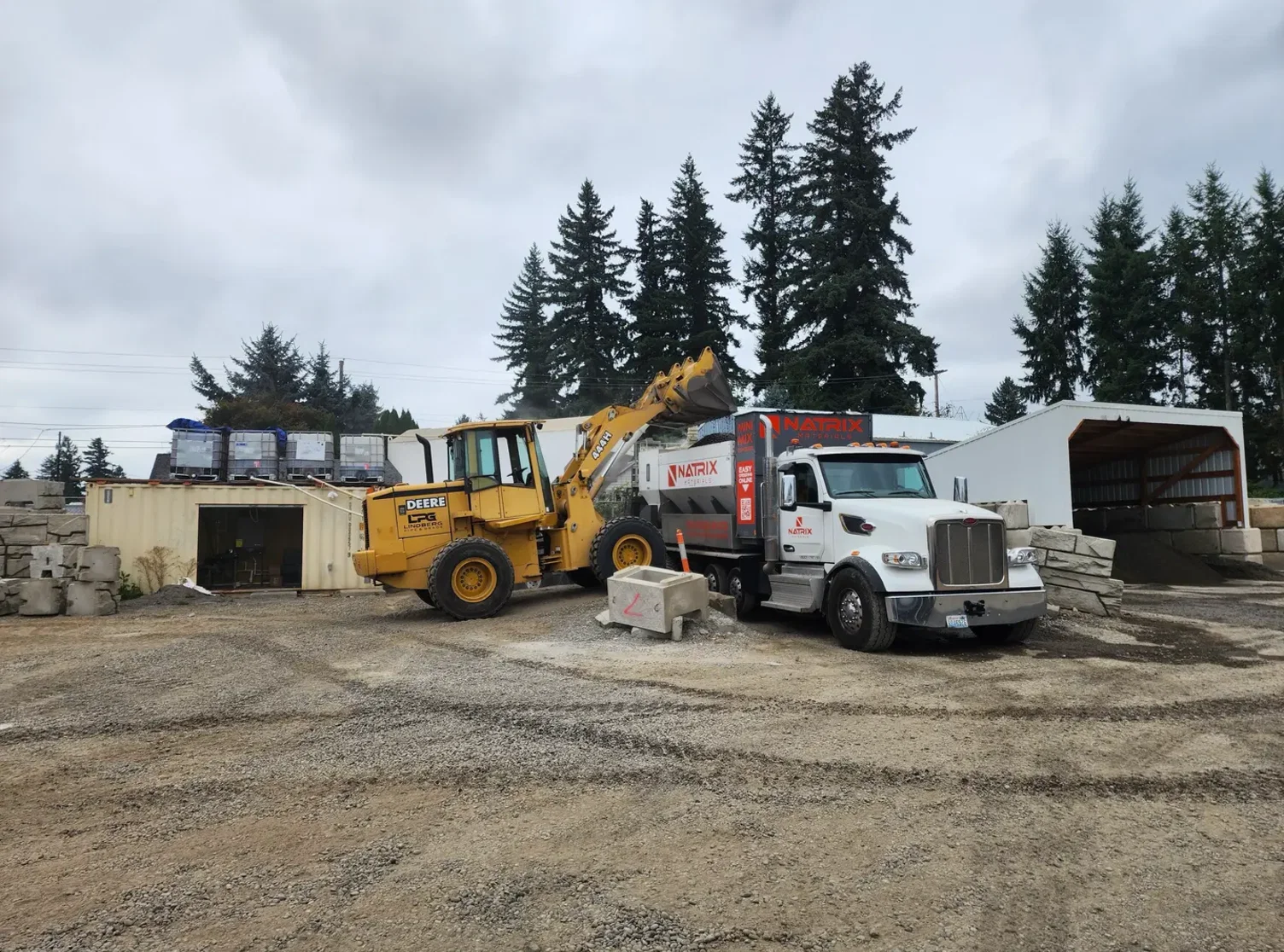 Natrix truck and loader on a job site