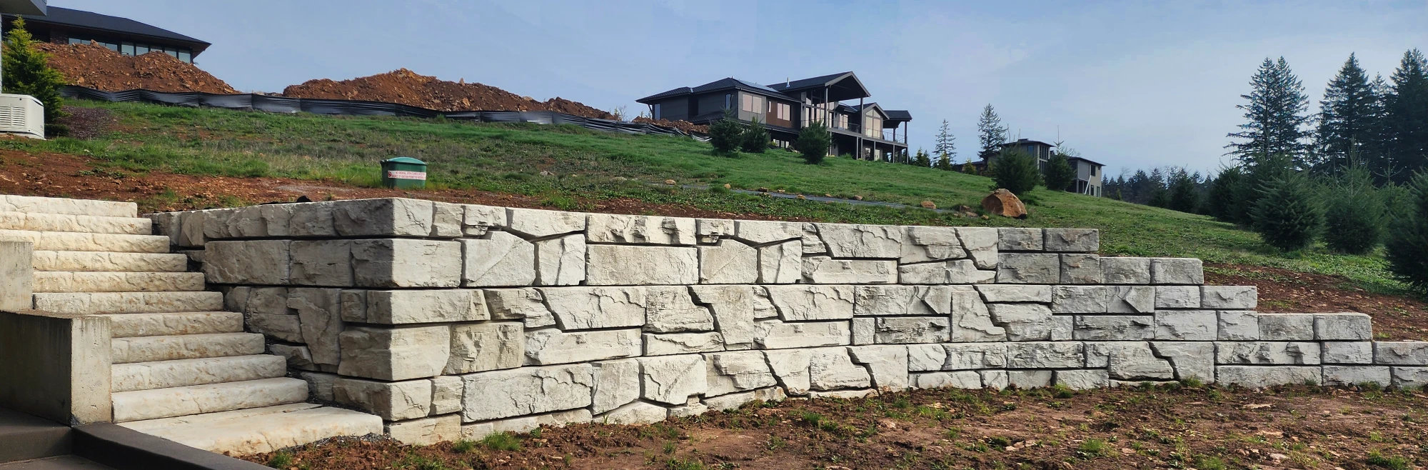Tiered Verti-Block wall with stairs below hillside homes